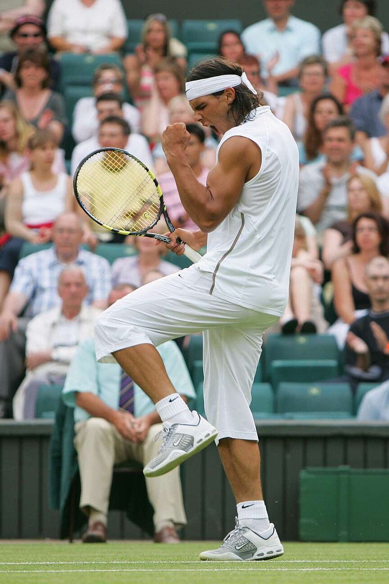 FILE - Spain's Rafael Nadal celebrates during his match against Vincent Spadea, of the United States, during a first round match in Wimbledon on June 21, 2005. (AP Photo/Alastair Grant, File)