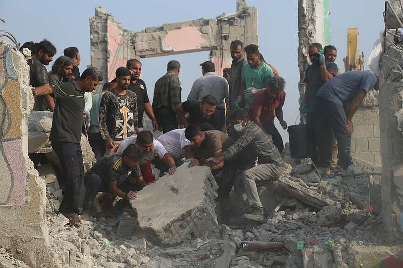 FILE.- Rescue workers and residents search through the rubble in the aftermath of a strike on a primary school in Minab, Iran, Saturday, Feb. 28, 2026. (Abbas Zakeri/Mehr News Agency via AP, File)