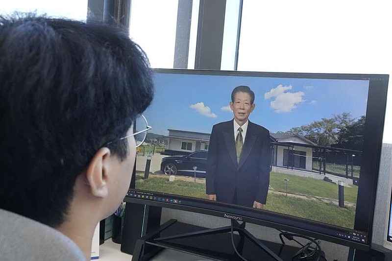 Lee Kun-hee stares at a computer screen as a video clip shows a digital portrait of his late grandfather speaking at Vice, a technology company based in Seoul, South Korea, on Friday, June 12, 2026. (AP Photo/Ahn Young Jun)