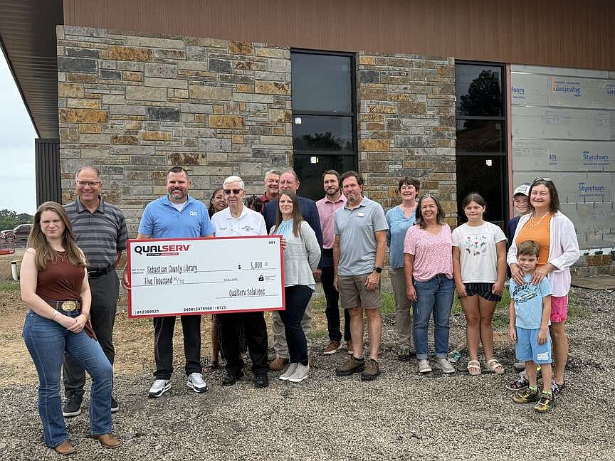 Library donations: Three businesses present $18,000 in donations to new Scott-Sebastian County Library for naming rights