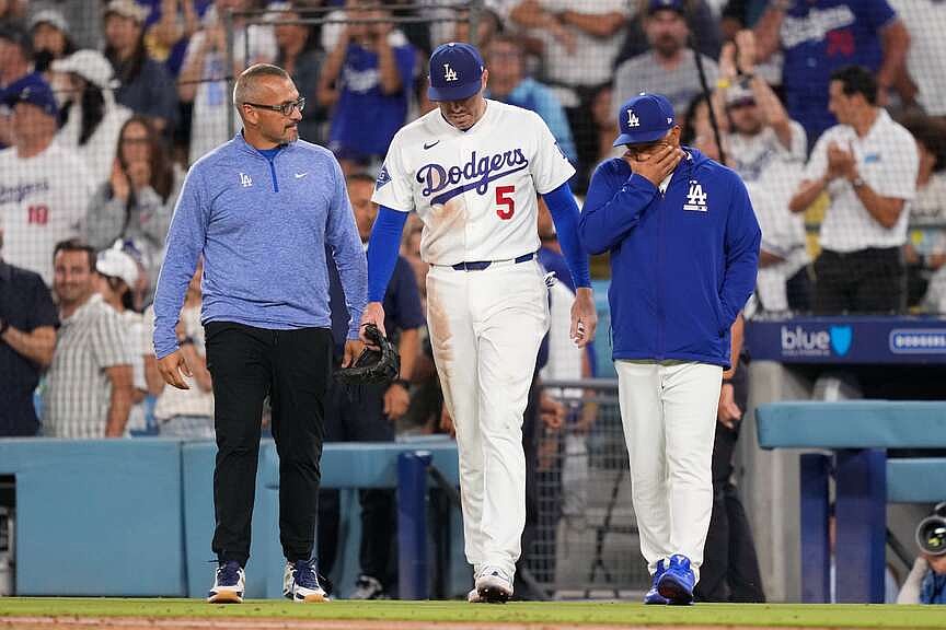 Freeman avoids major injury after fall into visitors’ dugout