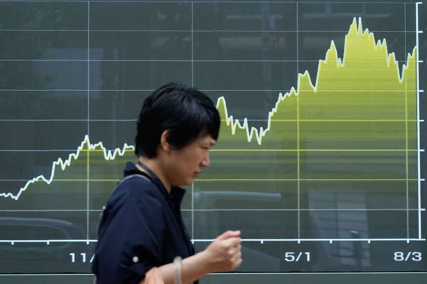 Wall Street falls from record after economy report