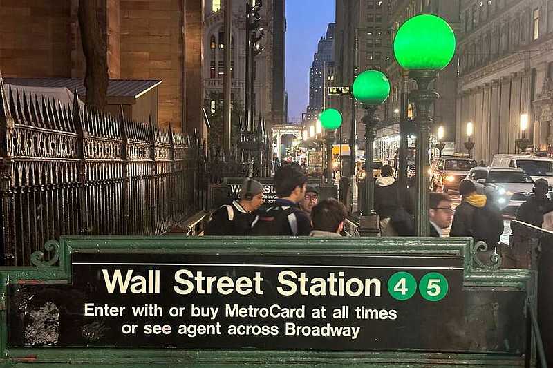 FILE - Commuters emerge from a Wall Street subway station in New York's Financial District on Wednesday, Oct. 30, 2024. (AP Photo/Peter Morgan, File)