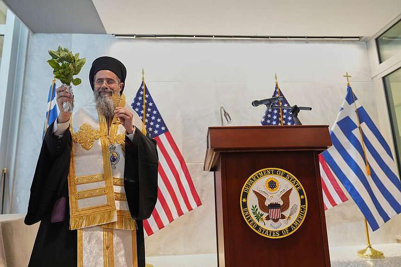 Bishop of Christoupoleos Varnavas Theoharis, blesses during a dedication ceremony at the chancery of the U.S. Embassy, with U.S. Ambassador to Greece Kimberly Guilfoyle and U.S. Secretary of State Marco Rubio on Wednesday, Oct. 7, 2026, in Athens, Greece. (AP Photo/Mark Schiefelbein, Pool)