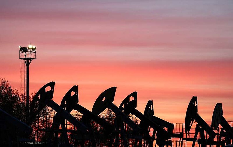 Sunset clouds glow over pump jacks at the Airankol oil field operated by Caspiy Neft in the Atyrau region, Kazakhstan, April 21, 2026. REUTERS/Pavel Mikheyev