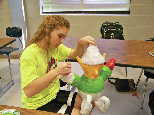 Star City High School students recycle newspapers into art
