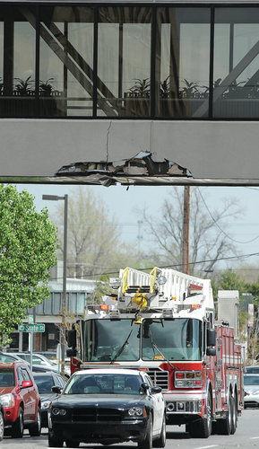 Truck strikes bank building, leaves scene, police say