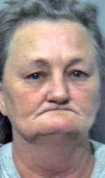 Woman arrested after reportedly shooting at house