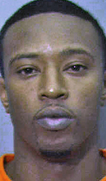 Search for murder suspect leads to gun arrest of another man