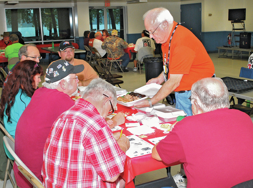 Rain fails to stop annual barbecue contest at Smoke on the Water