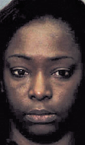 Woman arrested after allegedly pointing gun at another woman Thursday