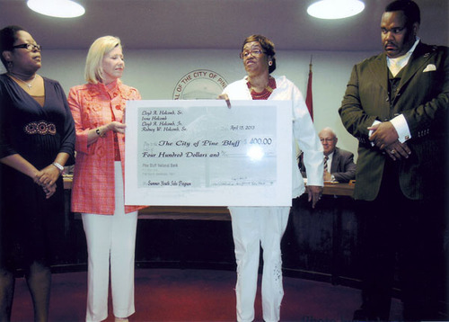 Holcombs donate to city youth jobs program