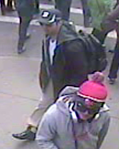Bombing suspects sought as video points to two men with heavy bags