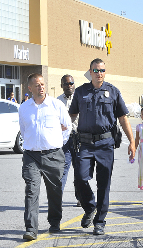 Man arrested after child is left in locked van on parking lot