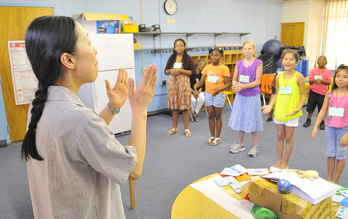 Local priest brings world to Pine Bluff children