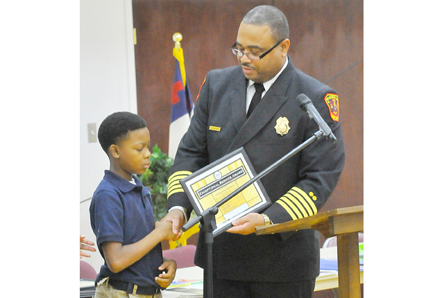 Student credited with saving family during fire at home