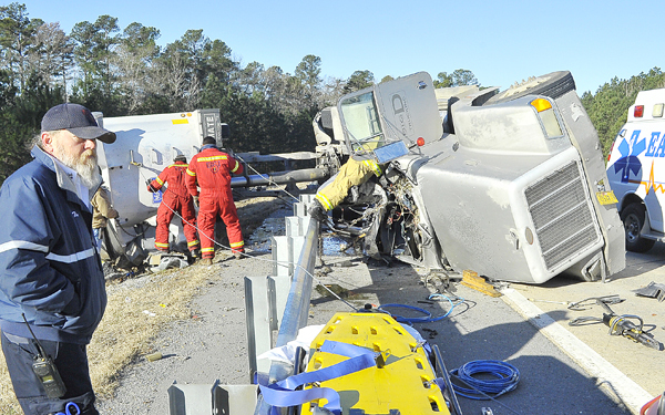 Gravel truck turns over just off I-530
