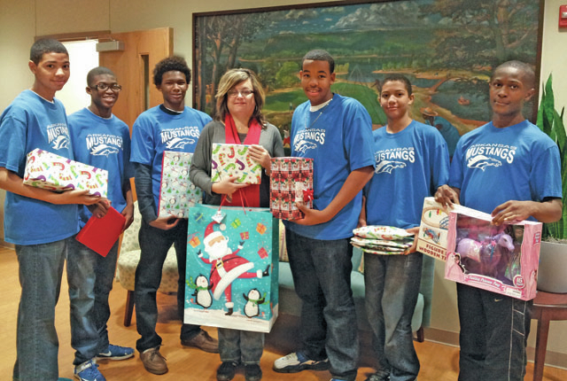 Players deliver gifts to CASA
