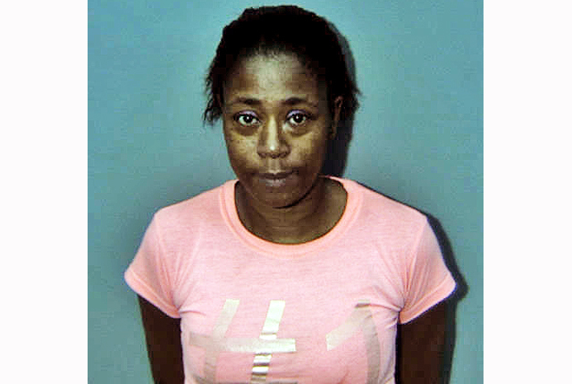 Woman accused of hitting boy with spatula, biting him