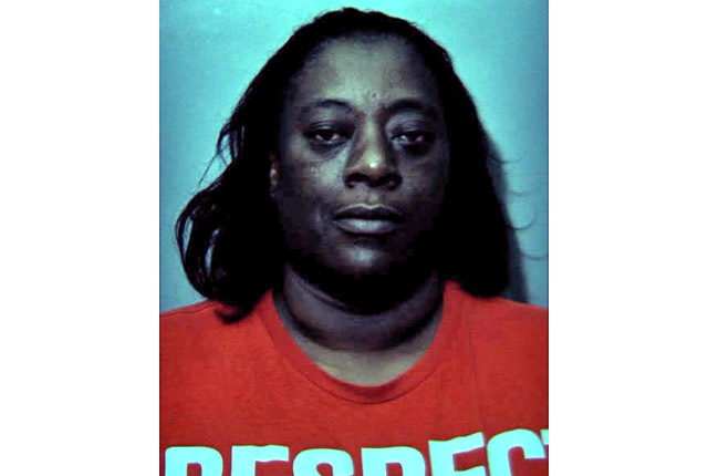 Woman arrested after allegedly pointing gun at neighbor