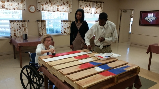Nursing home residents make decorations for Veterans Day