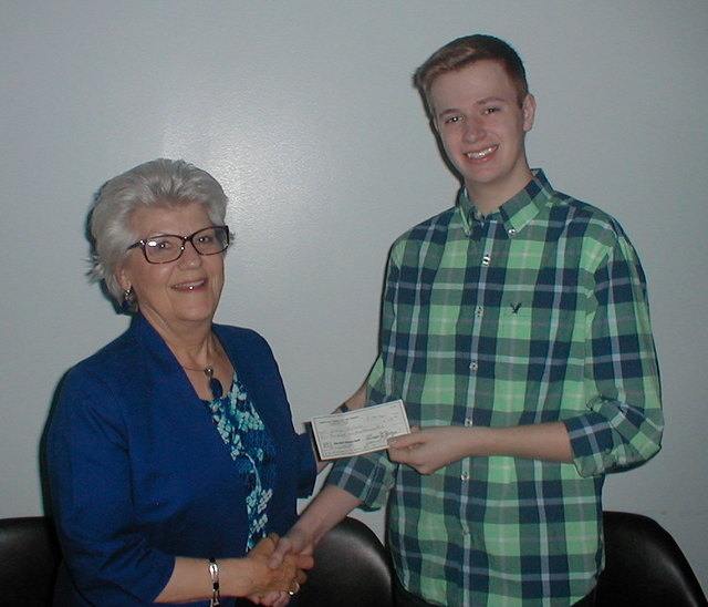 WH grad receives book award from library