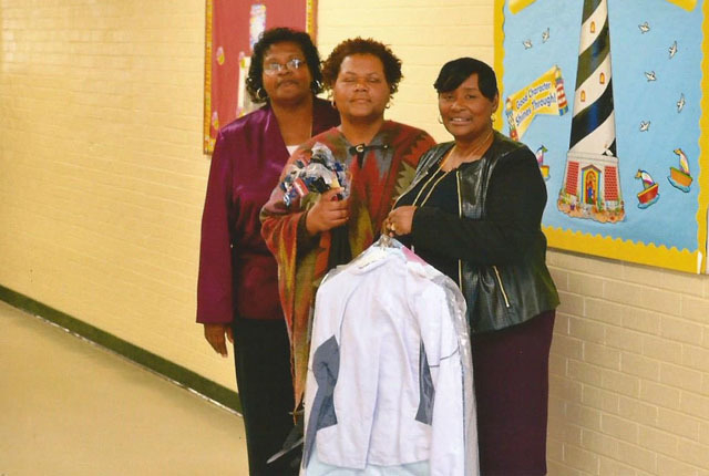 Westside neighbors make donation to Coleman school