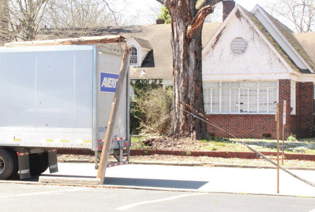 Truck hits pole
