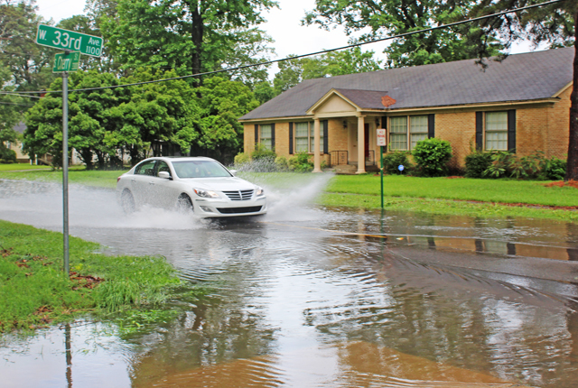 Downpour causes flash flooding; forecasters say more rain on the way
