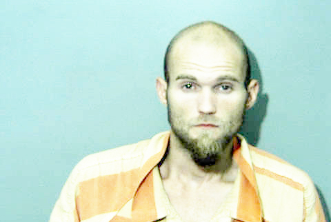 Man in ditch arrested after gun, suspected drugs found