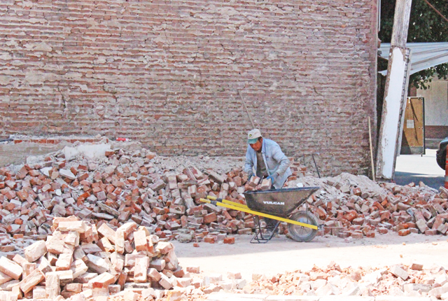 Cleanup of collapsed buildings begins in 400 block of Main Street