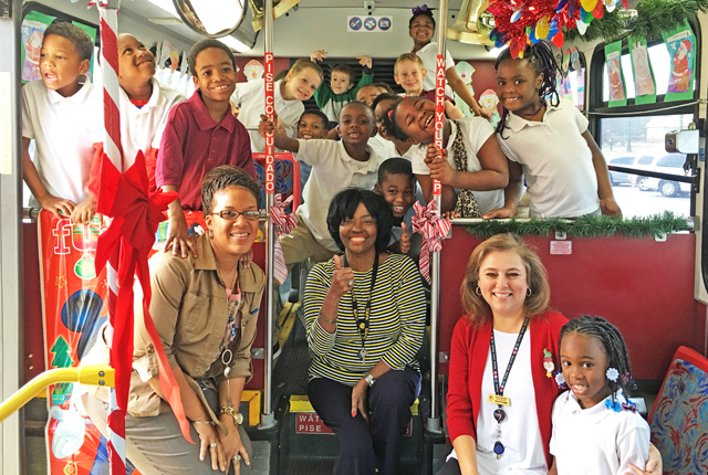 First-graders decorate Pine Bluff Transit bus for holidays