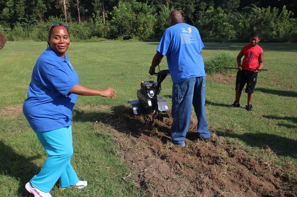 State gifts garden tiller to Merrill Community Center