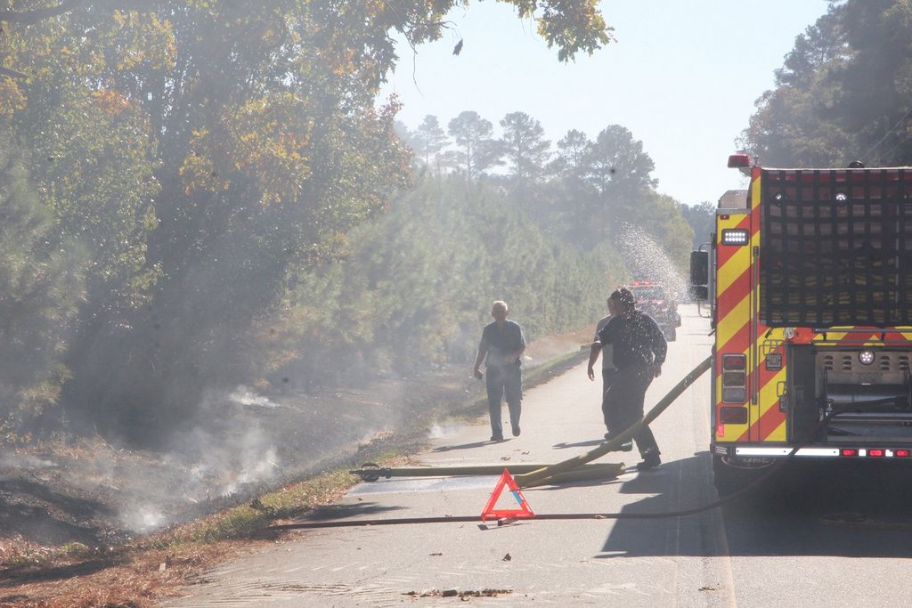 Brush fire nears houses as wildfire danger grows