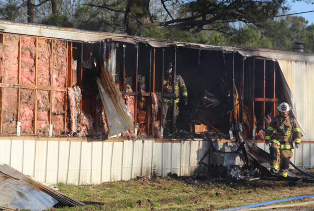 Firefighters extinguish blaze at trailer home; no one injured