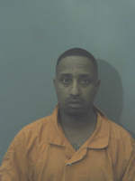 Man on parole arrested after gun found