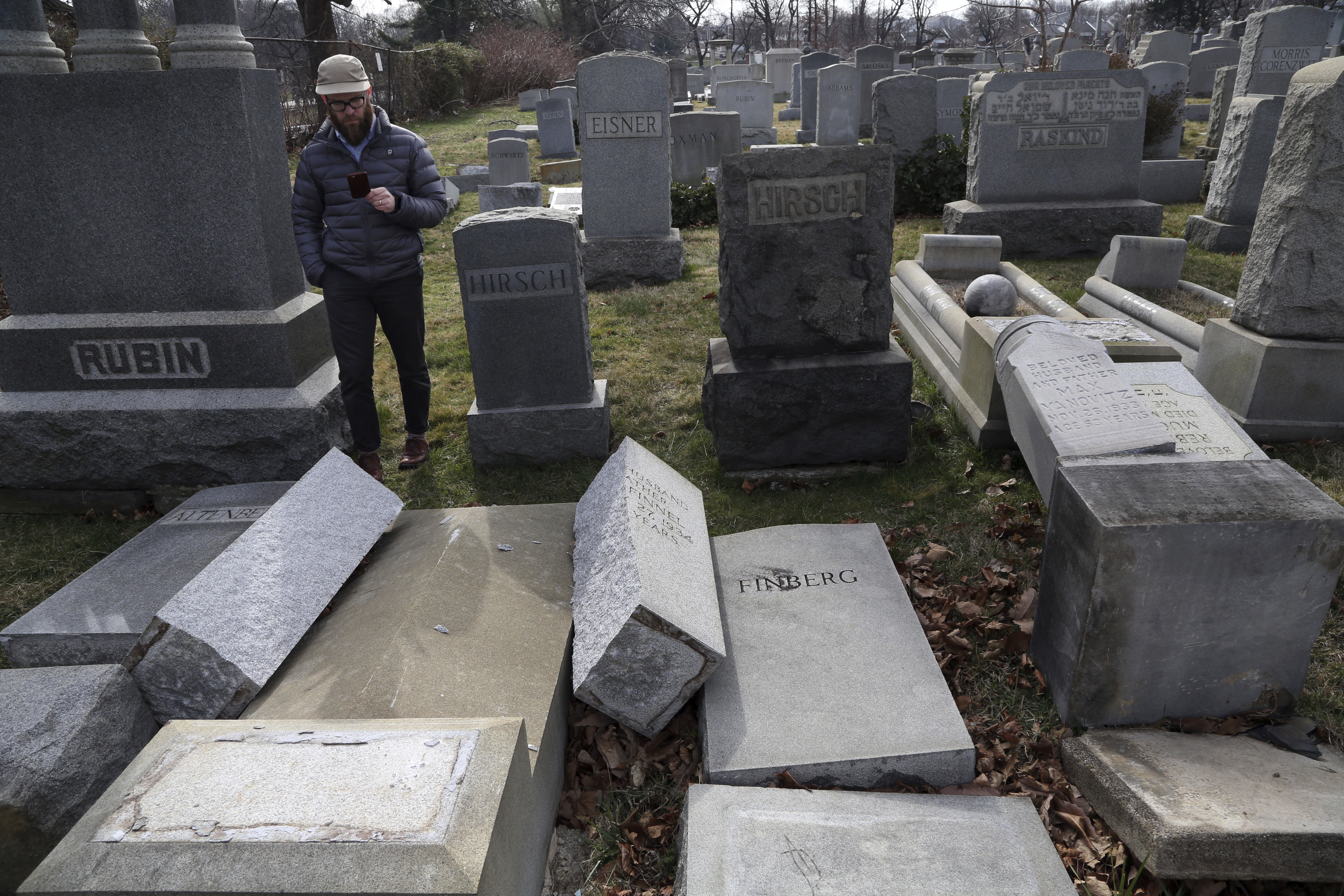 Jewish centers cope with new bomb threats; graves vandalized