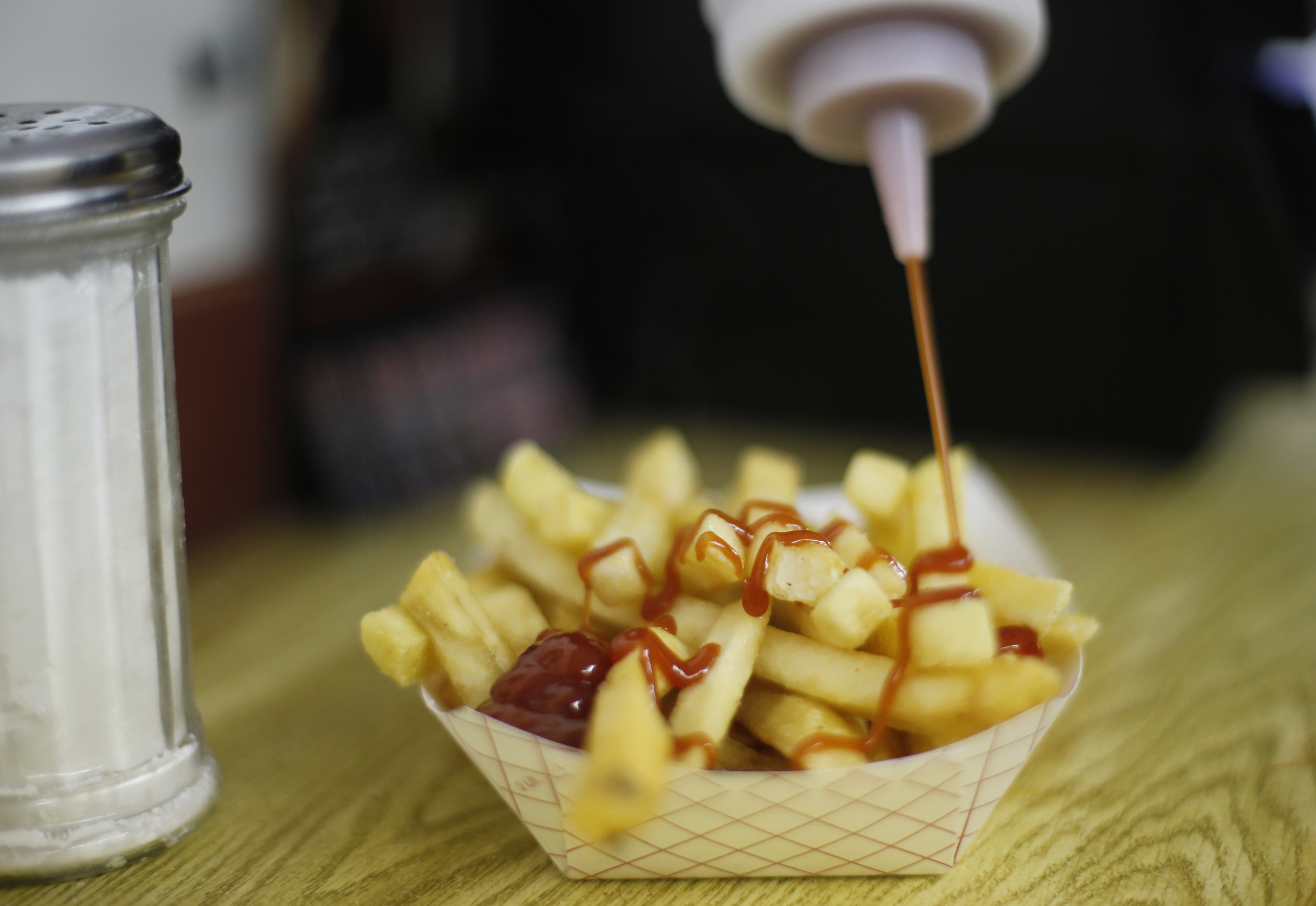 LIGHT LUNCH: Woman wants more salt on her fries, throws food at workers