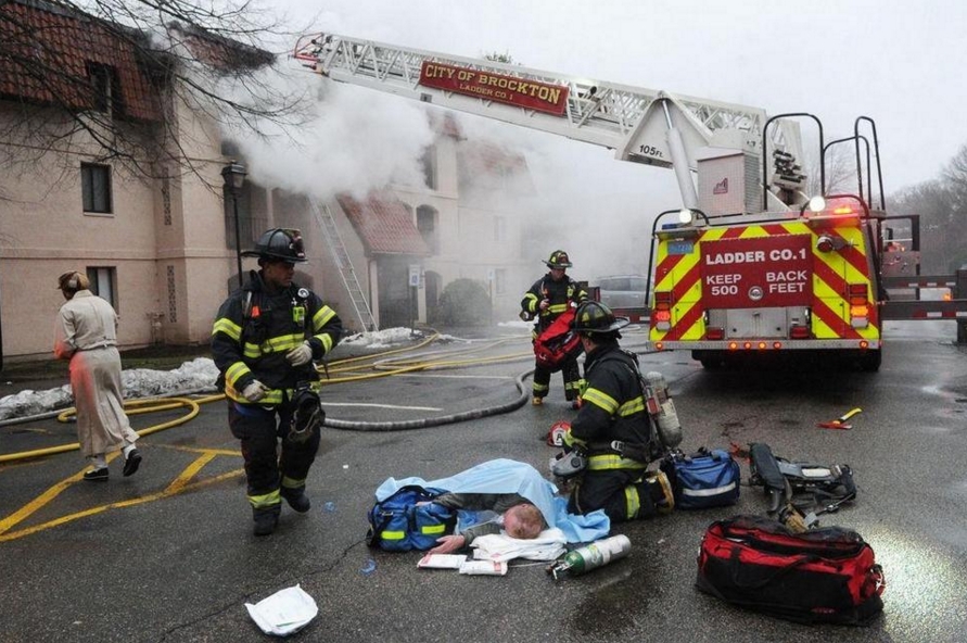Mass. firefighters pull man to safety as fire rages in dramatic video