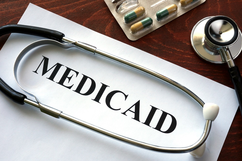 Arkansas governor signs bill to add Medicaid restrictions