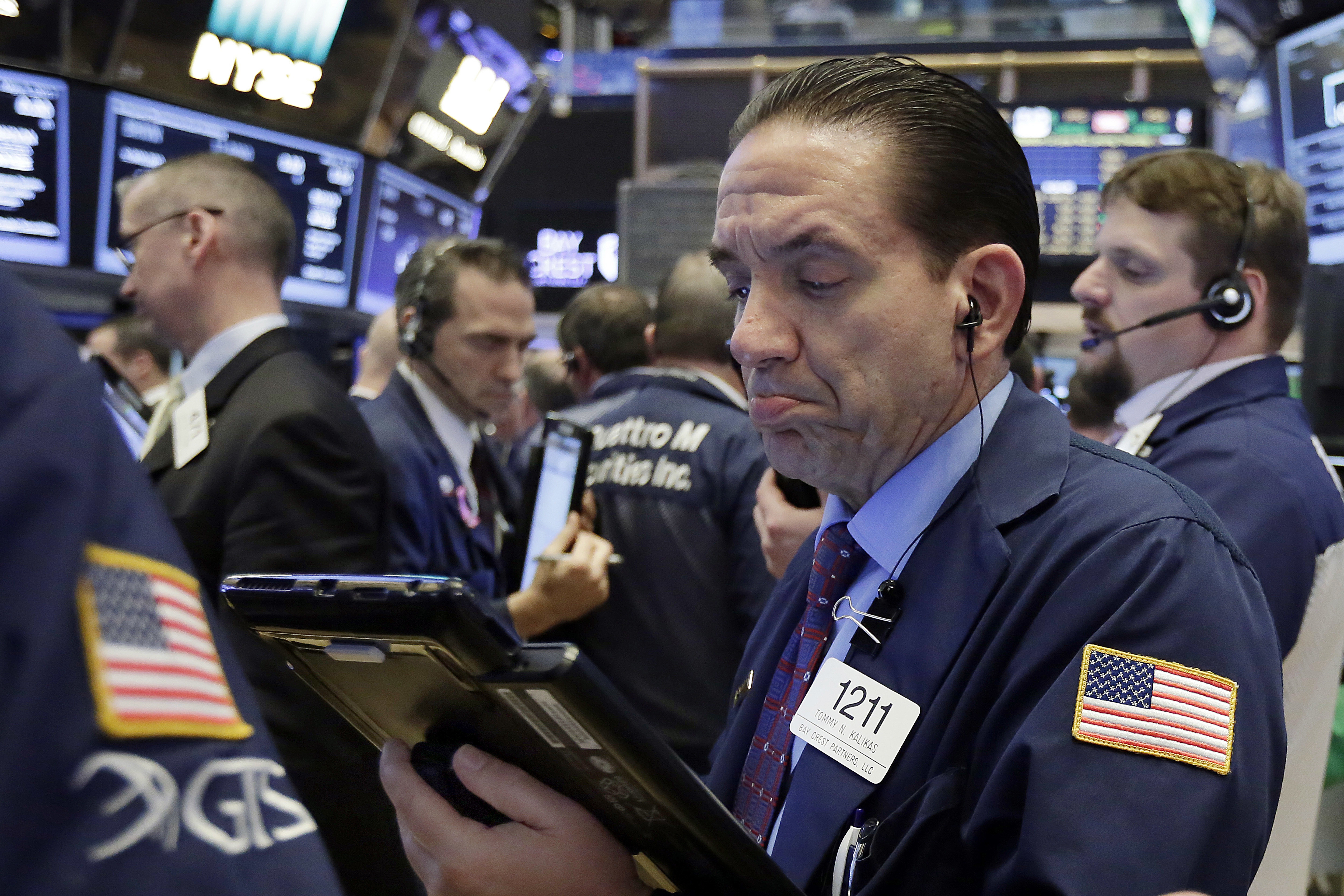 CLOSING BELL: Plunging oil prices weigh on stocks as other sectors edge up
