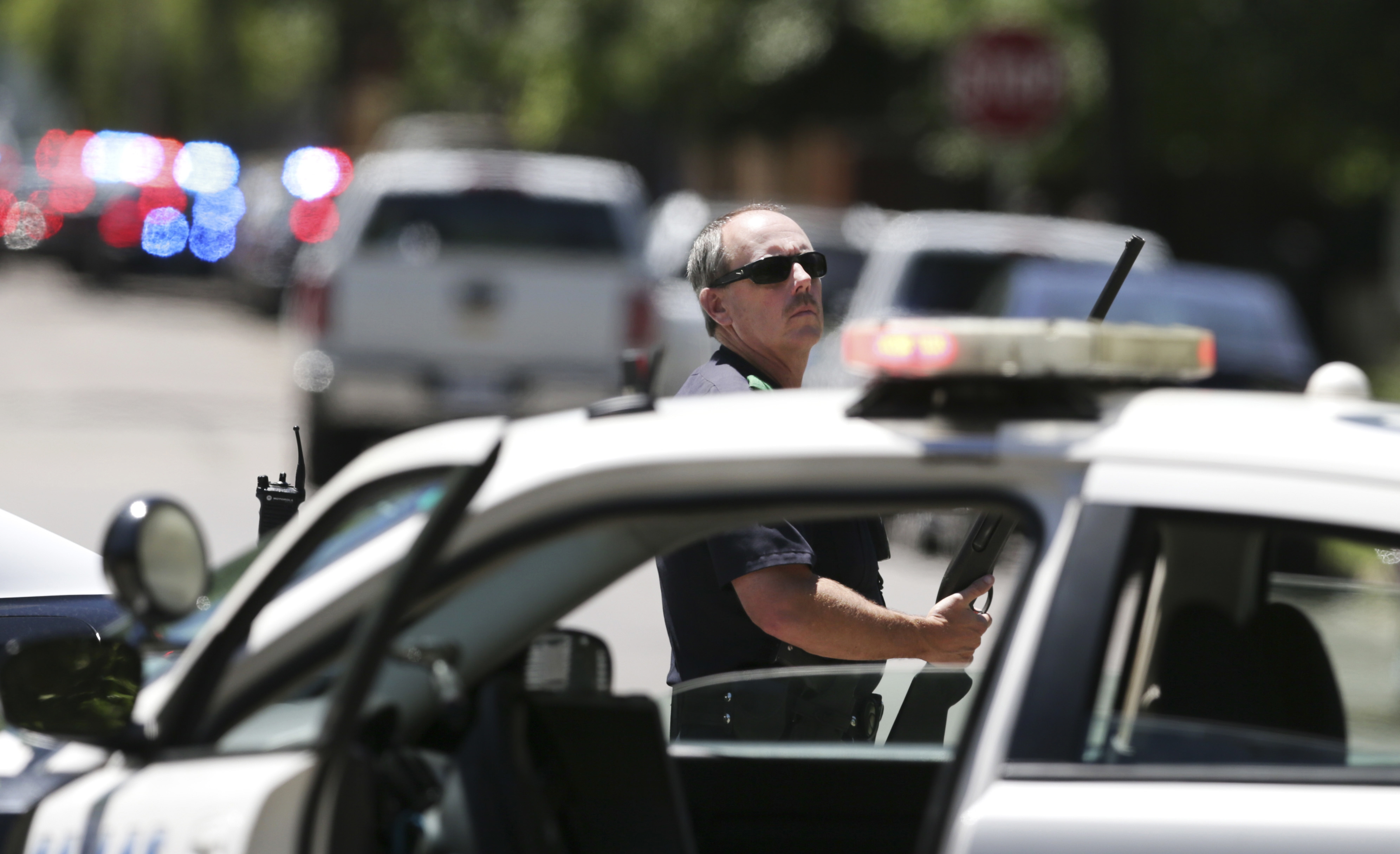 Police: Man killed roommate, then shot neighbor, paramedic