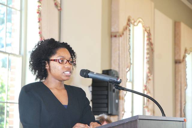Students discuss volunteer activities at Rotary Club meeting