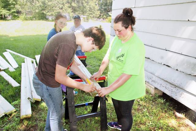 Ozark Mission Project volunteers help out in PB