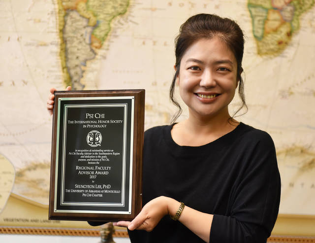 UAM psychology professor, honor society receive awards