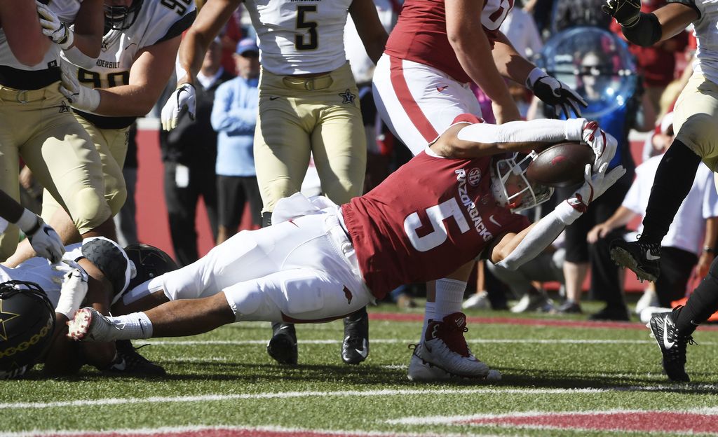 Vaughn’s 3 touchdowns spark Vandy past Arkansas, 45-31