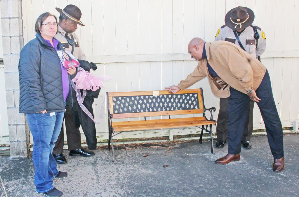 County honors former employee with bench at courthouse