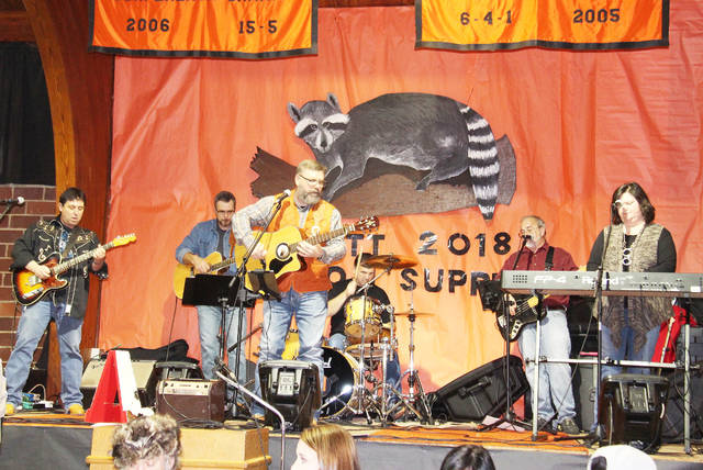 Politicians mix, mingle, eat racoon at annual supper