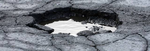 Rain hampers efforts to fill city’s potholes