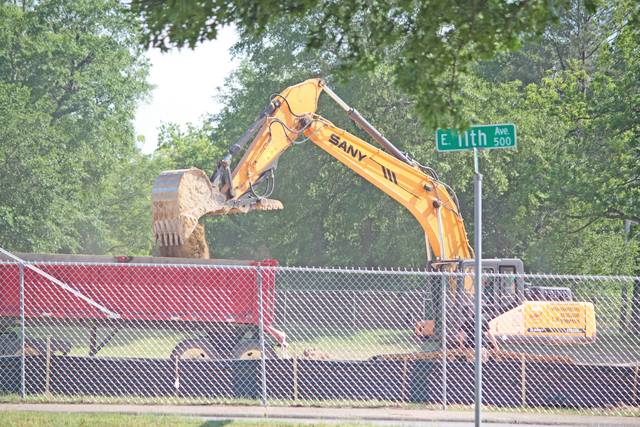 Heavy machinery prepping aquatics center site